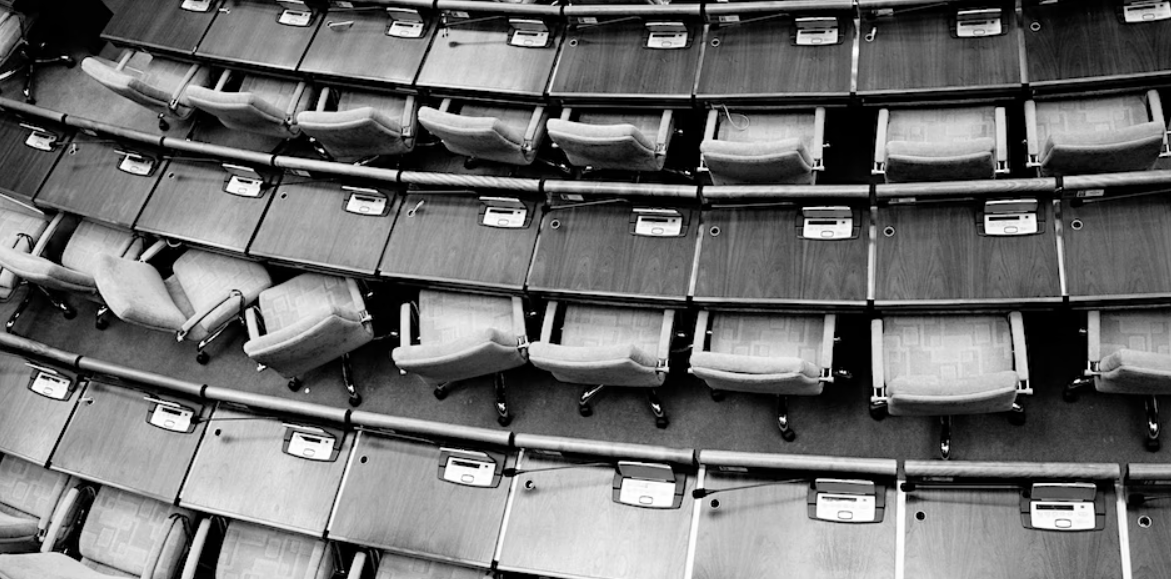 Empty rows of chairs in an auditorium