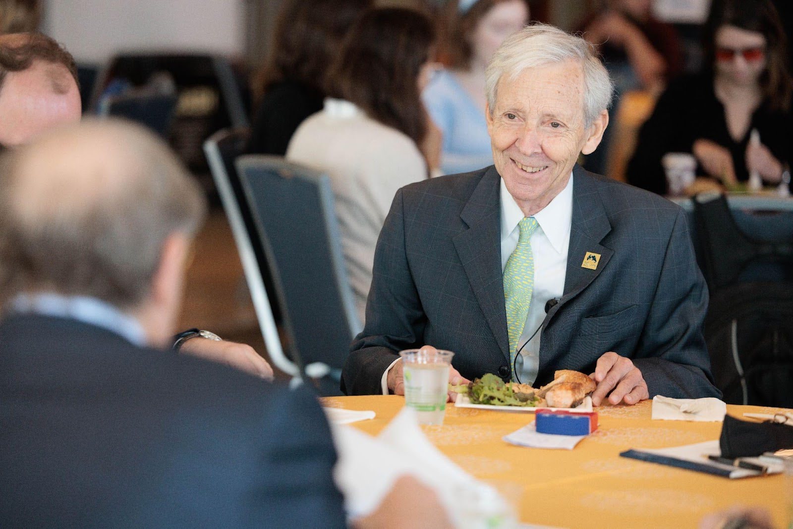 Man sitting a table smiling