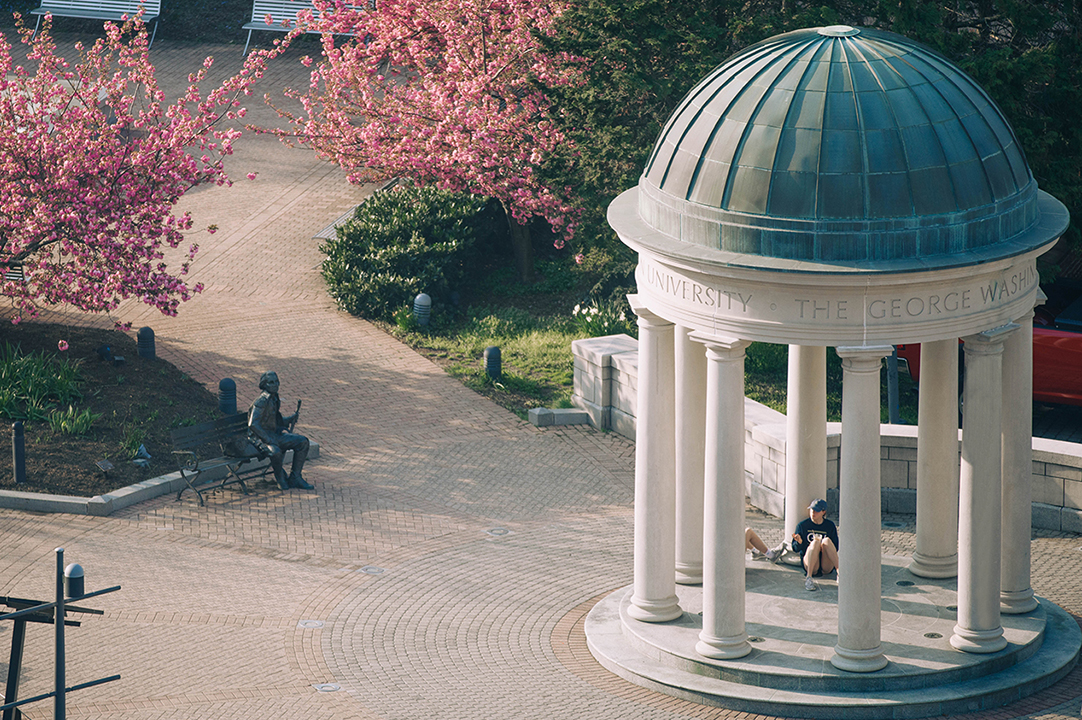 GW campus quad outdoor area with bricks and cherry blossoms