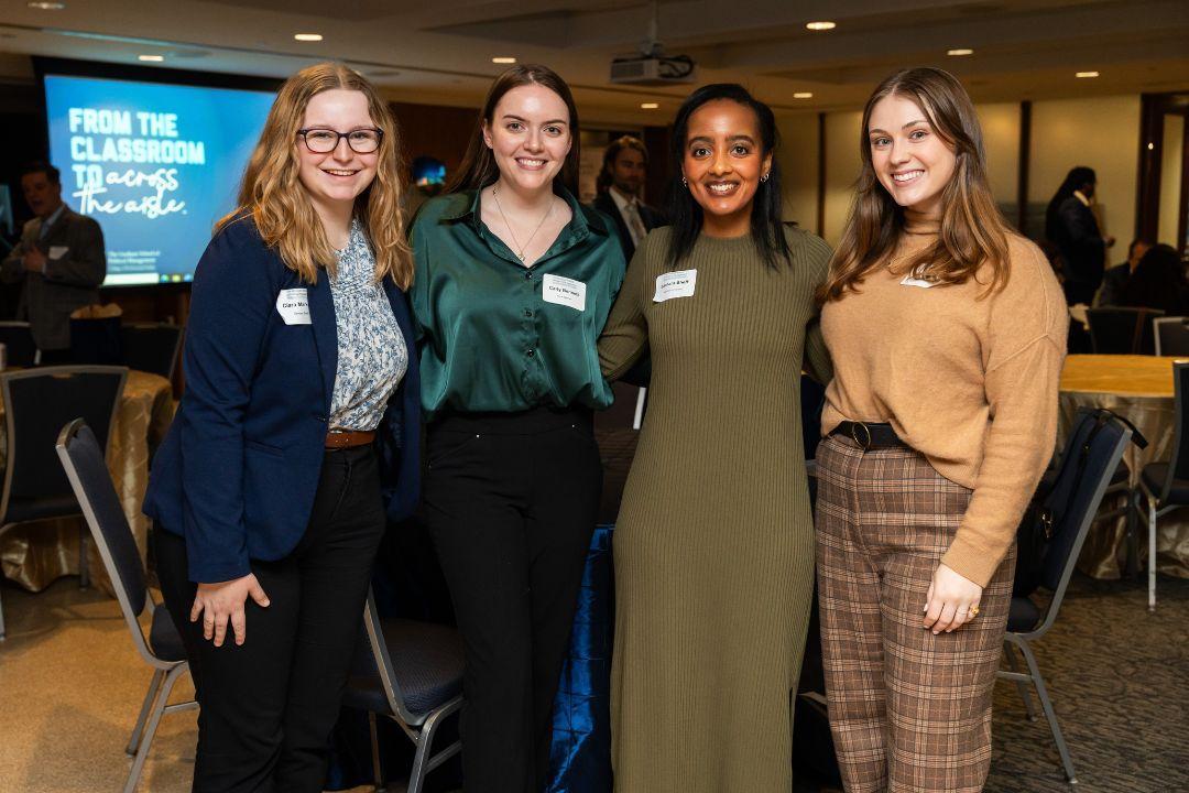 group of 4 students at an event